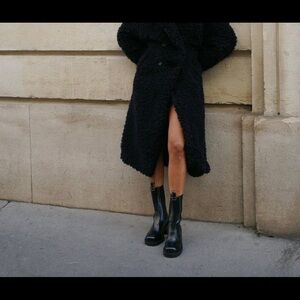 Flattered black leather boots